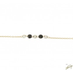 Pulsera en oro rojo de 18 Kts. Con 5 brillantes perforados, 2 de ellos negros